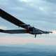 FILE- In this Monday, June 2, 2014 file photo, German test pilot Markus Scherdel steers the solar-powered Solar Impulse 2 aircraft for its maiden flight at its base in Payerne, Switzerland. Clean-energy company Masdar said Thursday, Sept. 25, 2014 that the Solar Impulse 2 plane will attempt its historic journey in March from the Abu Dhabi, United Arab Emirates. Project founders Bertrand Piccard and Andre Borschberg hope to complete the journey over four or five months, including stopovers. (AP Photo/Denis Balibouse,Pool, File)
